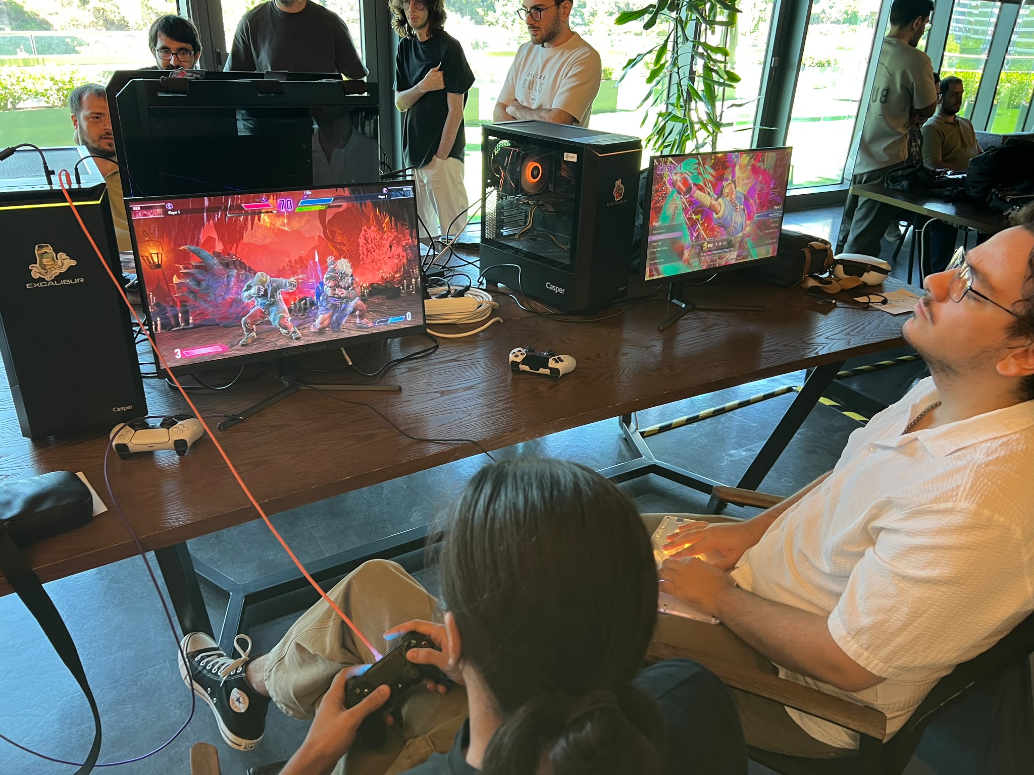 Tournament competitors playing Street Fighter VI